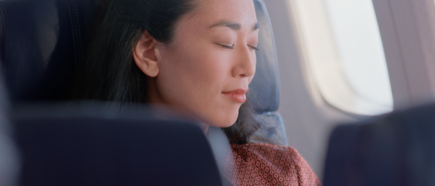 woman sleeping in the plane