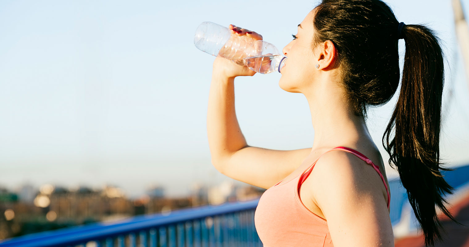 girl drink water after exercise