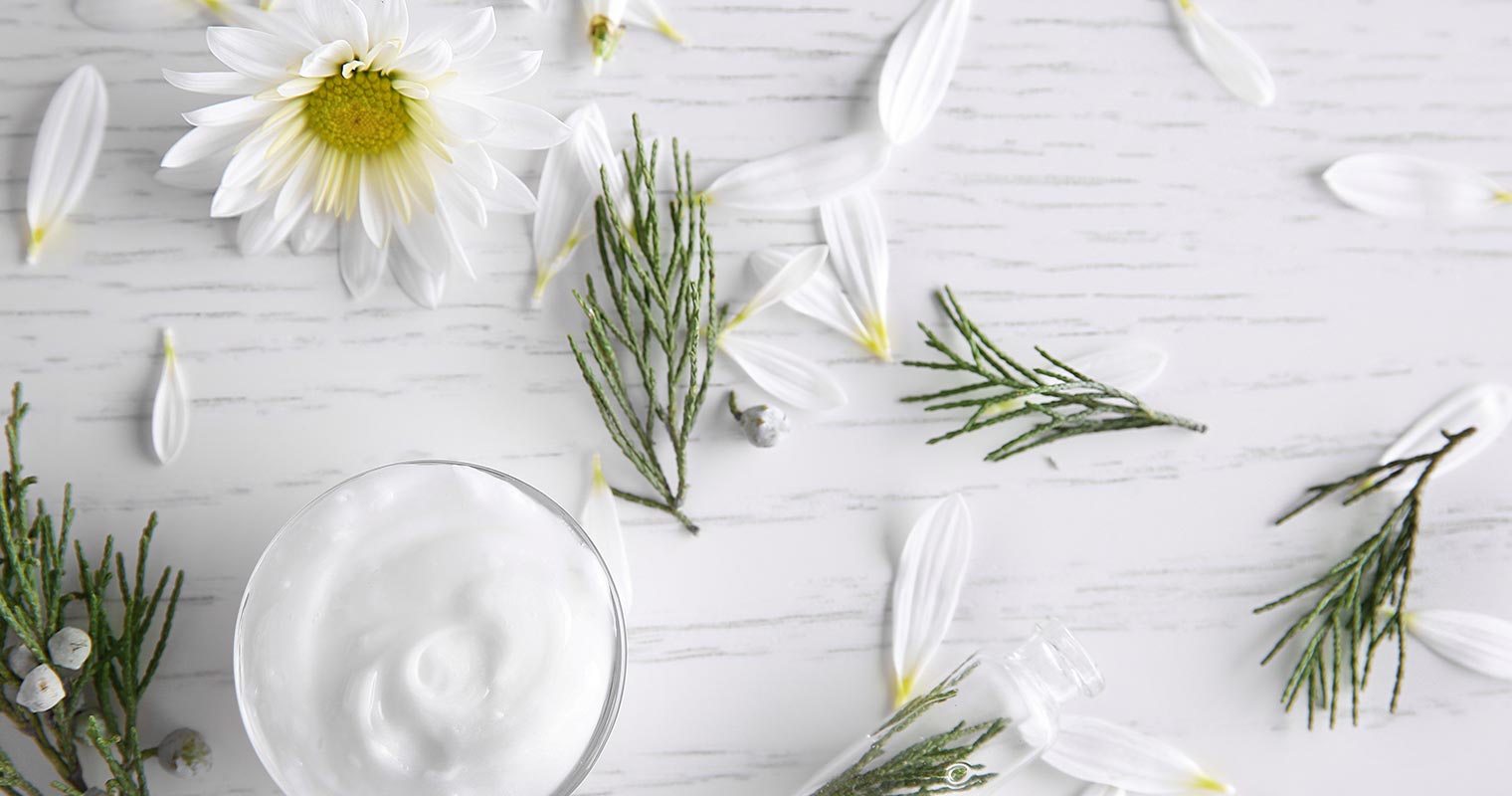chamomile petals scattered on a table