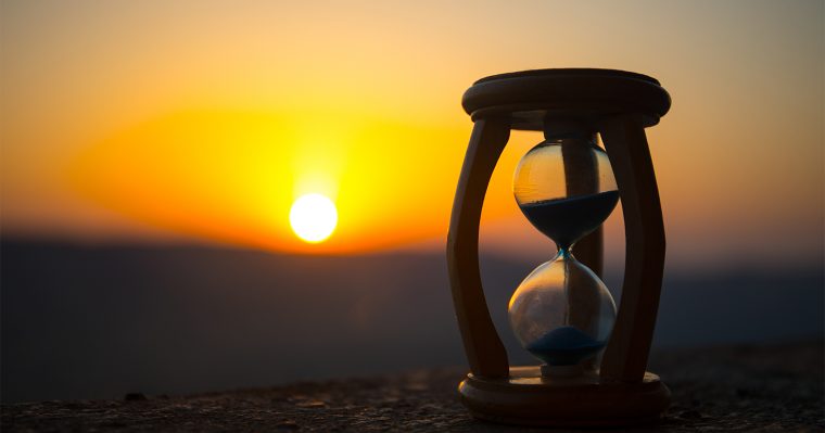hourglass with sunset